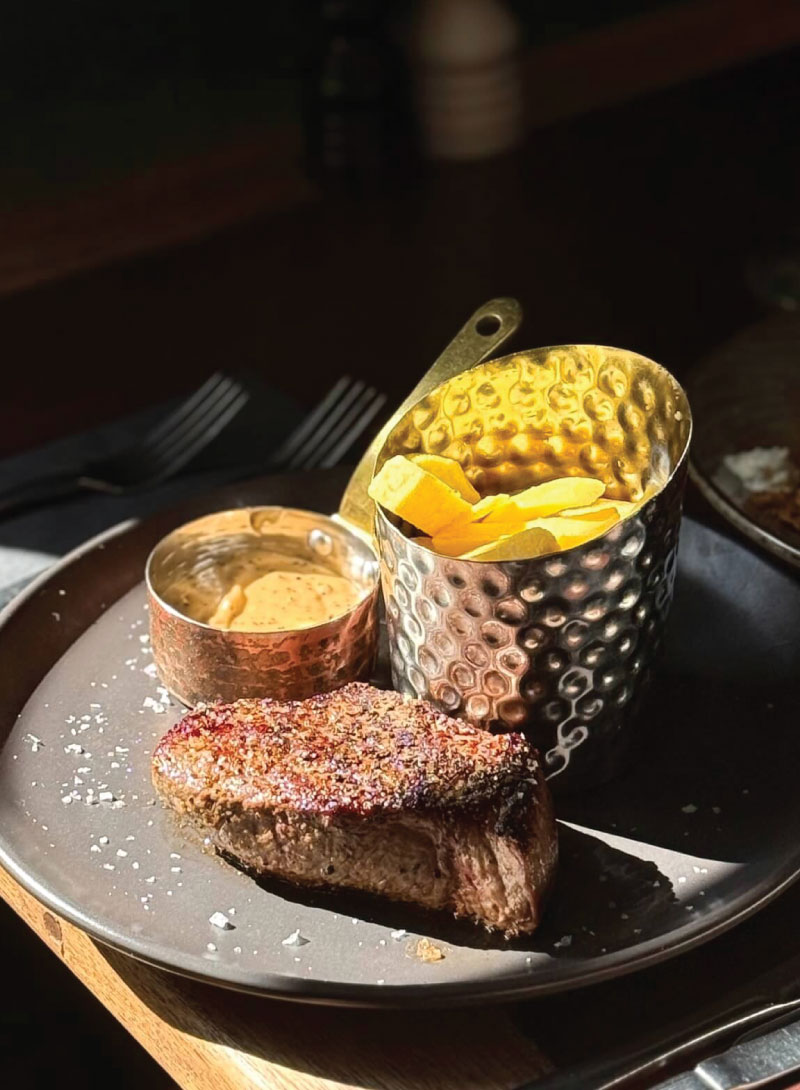 Head chef cooking at Le Bistrot French restaurant Edinburgh